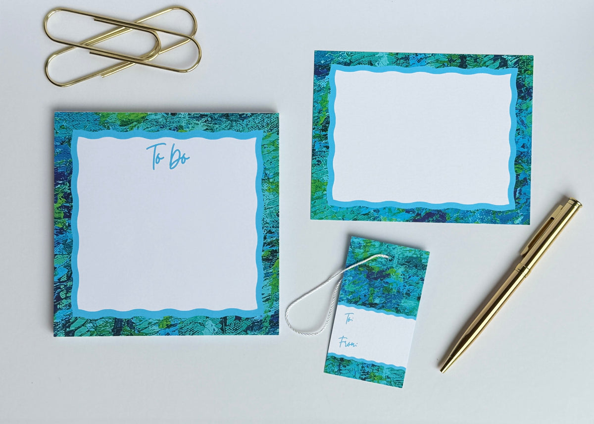 Coordinating notepads, notecards, and gift tags in matching abstract art designs